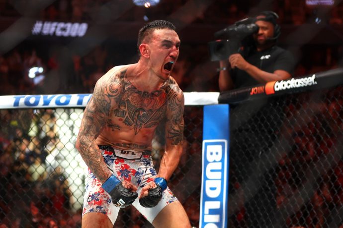 Apr 13, 2024; Las Vegas, Nevada, USA; Max Holloway (blue gloves) reacts after defeating Justin Gaethje (not pictured) during UFC 300 at T-Mobile Arena. Holloway is one of our best UFC props for this weekend.