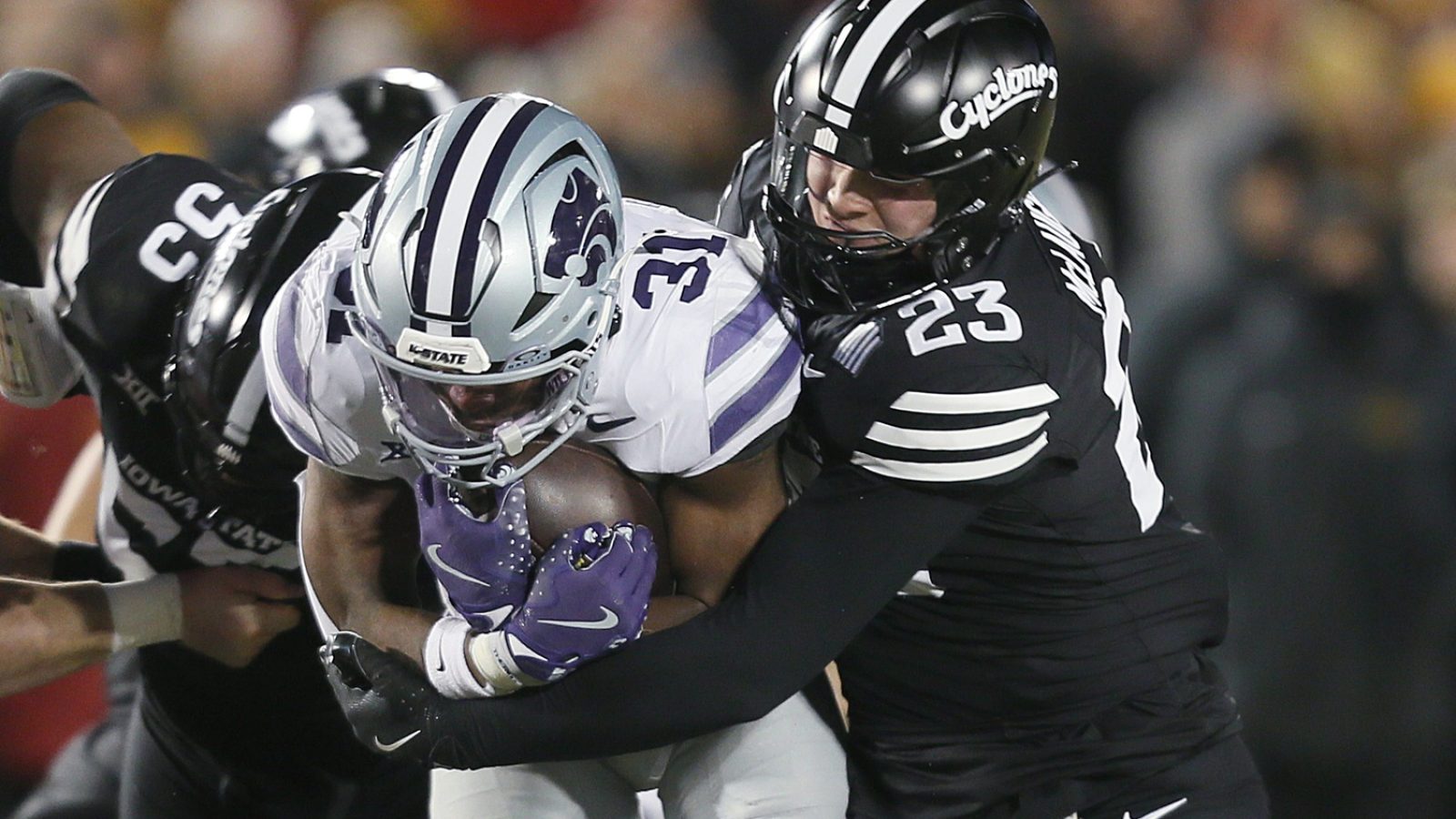 Iowa State Cyclones linebacker Will McLaughlin (23) takes down Kansas State Wildcats running back DJ Giddens (31) during the first quarter in the NCAA football at Jack Trice Stadium on Saturday, Nov. 30, 2024, in Ames, Iowa.