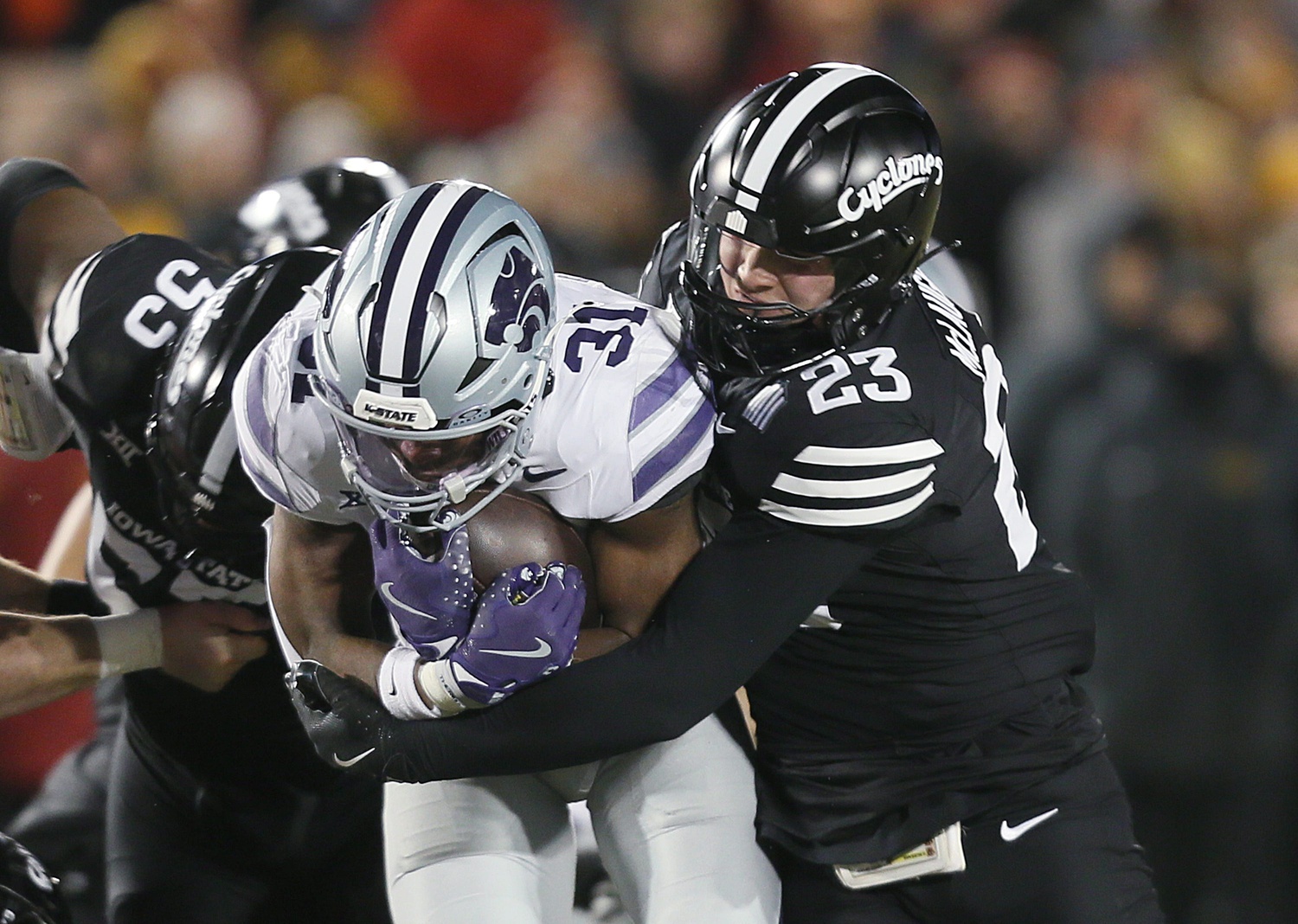 Iowa State Cyclones linebacker Will McLaughlin (23) takes down Kansas State Wildcats running back DJ Giddens (31) during the first quarter in the NCAA football at Jack Trice Stadium on Saturday, Nov. 30, 2024, in Ames, Iowa.
