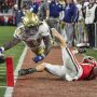 Nov 29, 2024; Athens, Georgia, USA; Georgia Tech Yellow Jackets running back Jamal Haynes (11) scores a touchdown past Georgia Bulldogs defensive back Dan Jackson (17) during the first half at Sanford Stadium.