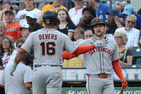 San Francisco Giants catcher Patrick Bailey (right) greets first baseman Rafael Devers (16) crossing home plate to score a run against the Pittsburgh Pirates during the first inning at PNC Park.