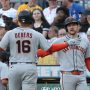 San Francisco Giants catcher Patrick Bailey (right) greets first baseman Rafael Devers (16) crossing home plate to score a run against the Pittsburgh Pirates during the first inning at PNC Park.