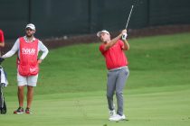 Aug 23, 2025; Atlanta, Georgia, USA; Russell Henley takes a shot on the 12th hole during the third round of the TOUR Championship golf tournament.