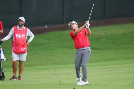 Aug 23, 2025; Atlanta, Georgia, USA; Russell Henley takes a shot on the 12th hole during the third round of the TOUR Championship golf tournament.