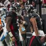 Jan 5, 2025; Atlanta, Georgia, USA; Atlanta Falcons running back Bijan Robinson (7) reacts with quarterback Michael Penix Jr. (9) after running for a touchdown against the Carolina Panthers during the second half at Mercedes-Benz Stadium.