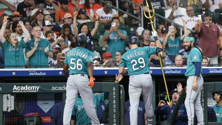 Sep 21, 2025; Houston, Texas, USA; Seattle Mariners catcher Cal Raleigh (29) raises the trident after hitting a two-run home run against the Houston Astros in the second inning at Daikin Park.