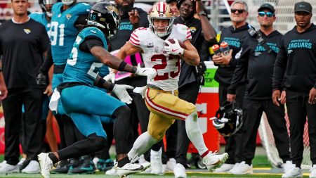 San Francisco 49ers running back Christian McCaffrey (23) runs after a catch against Jacksonville Jaguars linebacker Yasir Abdullah (56) during the second half at Levi's Stadium.