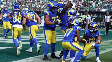 Los Angeles Rams running back Kyren Williams (23) reacts with wide receiver Davante Adams (17) and wide receiver Puka Nacua (12) after a touchdown during the second half at Lincoln Financial Field.