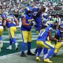 Los Angeles Rams running back Kyren Williams (23) reacts with wide receiver Davante Adams (17) and wide receiver Puka Nacua (12) after a touchdown during the second half at Lincoln Financial Field.