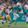 Miami Dolphins running back De'Von Achane (28) runs with the football against the San Francisco 49ers during the fourth quarter at Hard Rock Stadium.