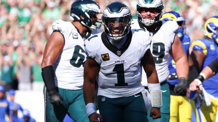 Sep 21, 2025; Philadelphia, Pennsylvania, USA; Philadelphia Eagles quarterback Jalen Hurts (1) reacts after a touchdown pass to wide receiver Devonta Smith (not pictured) during the fourth quarter against the Los Angeles Rams at Lincoln Financial Field.