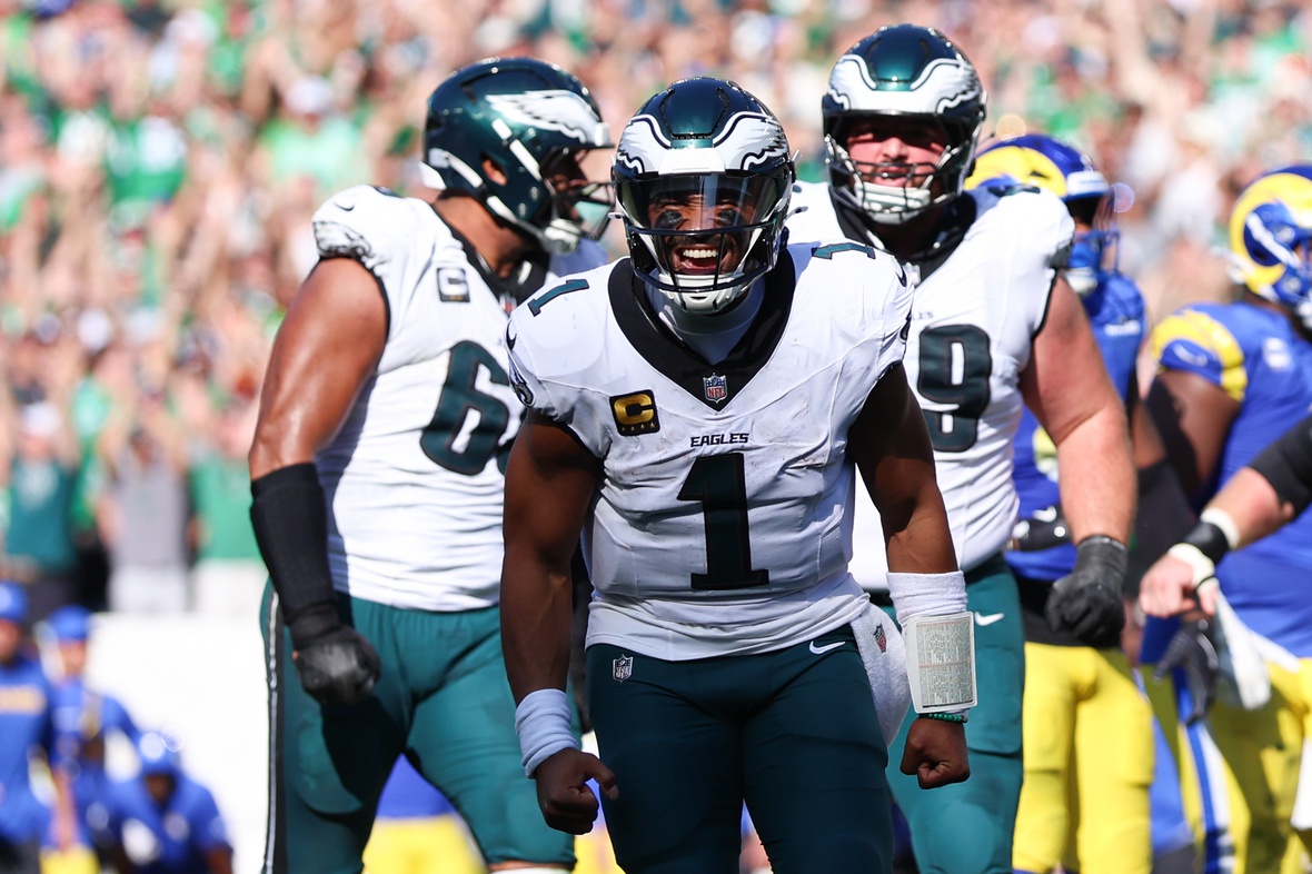 Sep 21, 2025; Philadelphia, Pennsylvania, USA; Philadelphia Eagles quarterback Jalen Hurts (1) reacts after a touchdown pass to wide receiver Devonta Smith (not pictured) during the fourth quarter against the Los Angeles Rams at Lincoln Financial Field.