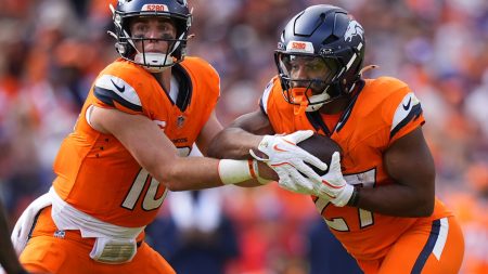 Sep 7, 2025; Denver, Colorado, USA; Denver Broncos running back J.K. Dobbins (27) receives a hand off from quarterback Bo Nix (10) during the second half at Empower Field at Mile High.