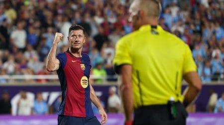 Barcelona forward Robert Lewandowski (9) reacts after making a penalty kick against Manchester City in a tie breaker during a Champions Tour friendly match at Camping World Stadium