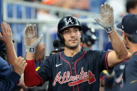 Aug 27, 2025; Miami, Florida, USA; Atlanta Braves first baseman Matt Olson (28) celebrates after hitting a home run against the Miami Marlins during the third inning at loanDepot Park.