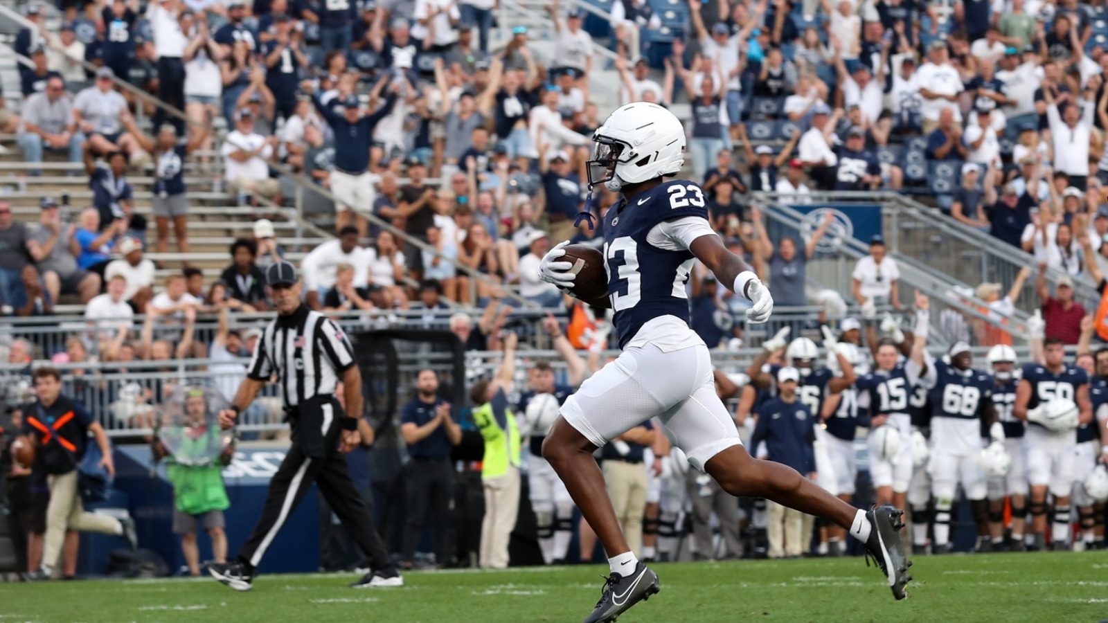 Sep 13, 2025; University Park, Pennsylvania, USA; Penn State Nittany Lions cornerback Jahmir Joseph (23) runs the ball into the end zone following an interception during the fourth quarter against the Villanova Wildcats at Beaver Stadium.