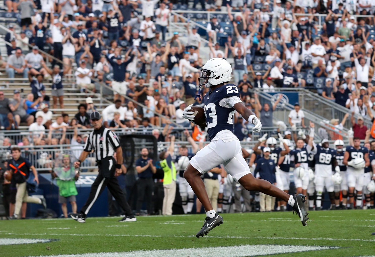 Sep 13, 2025; University Park, Pennsylvania, USA; Penn State Nittany Lions cornerback Jahmir Joseph (23) runs the ball into the end zone following an interception during the fourth quarter against the Villanova Wildcats at Beaver Stadium.