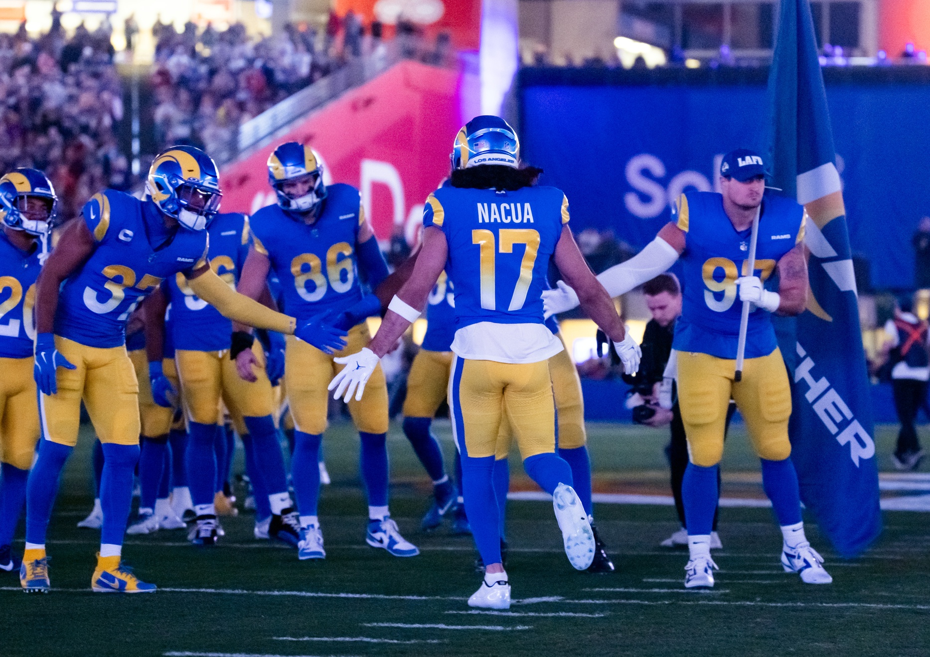 Jan 13, 2025; Glendale, AZ, USA; Los Angeles Rams wide receiver Puka Nacua (17) greets teammates prior to the game against the Minnesota Vikings in an NFC wild card game at State Farm Stadium.