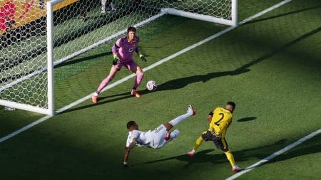 [Subscription Customers Only] Jul 5, 2025; East Rutherford, New Jersey, USA; Real Madrid CF forward Kylian Mbappe (9) scores their third goal against Borussia Dortmund goalkeeper Gregor Kobel (1) during a quarterfinal match of the 2025 FIFA Club World Cup at MetLife Stadium.