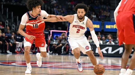 Oct 16, 2025; Detroit, Michigan, USA; Detroit Pistons guard Cade Cunningham (2) drives past Washington Wizards forward Kyshawn George (18) in the first quarter at Little Caesars Arena.