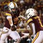 Oct 11, 2025; Minneapolis, Minnesota, USA; Minnesota Golden Gophers quarterback Drake Lindsey (5) hands the ball off to running back Darius Taylor (1) against the Purdue Boilermakers during the first half at Huntington Bank Stadium.