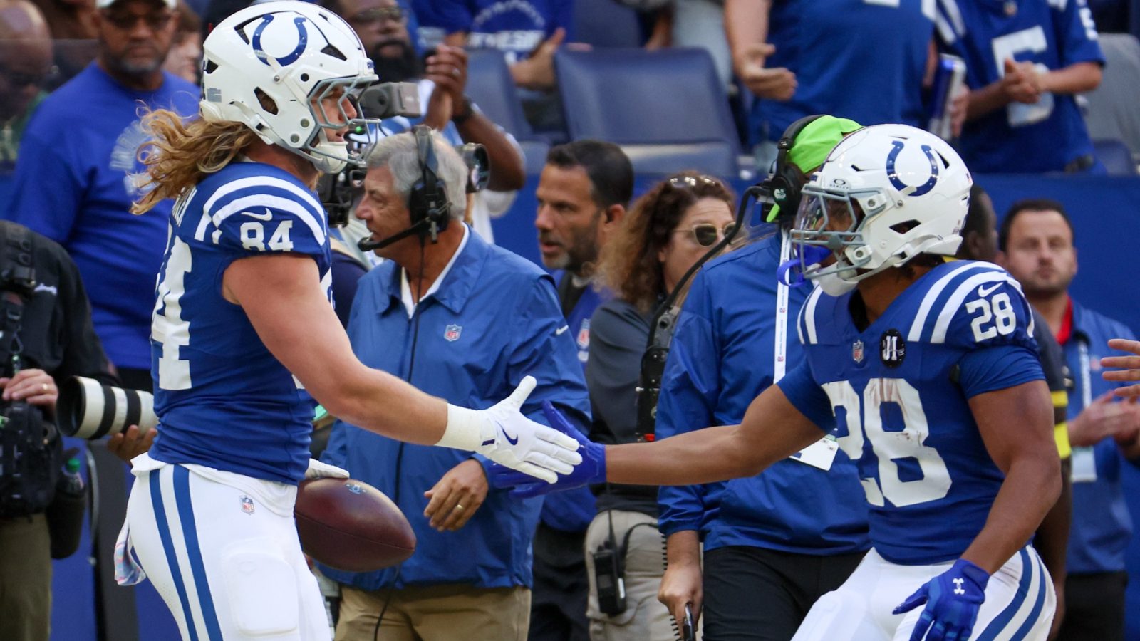 Oct 12, 2025; Indianapolis, Indiana, USA; Indianapolis Colts tight end Tyler Warren (84) celebrates with running back Jonathan Taylor (28) after a reception against the Arizona Cardinals during the first quarter of the game at Lucas Oil Stadium.