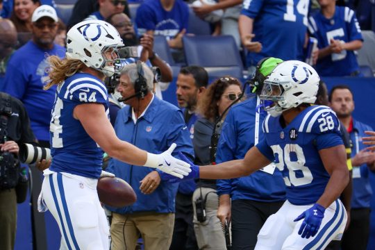 Oct 12, 2025; Indianapolis, Indiana, USA; Indianapolis Colts tight end Tyler Warren (84) celebrates with running back Jonathan Taylor (28) after a reception against the Arizona Cardinals during the first quarter of the game at Lucas Oil Stadium.