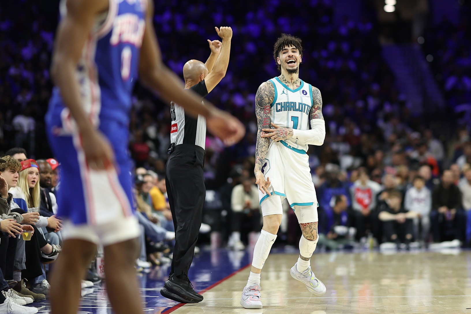 Oct 25, 2025; Philadelphia, Pennsylvania, USA; Charlotte Hornets guard LaMelo Ball (1) reacts to his three pointer against the Philadelphia 76ers during the third quarter at Xfinity Mobile Arena.