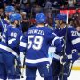 Oct 9, 2025; Tampa, Florida, USA; Tampa Bay Lightning right wing Nikita Kucherov (86) is congratulated by defenseman Victor Hedman (77), center Jake Guentzel (59) and right wing Oliver Bjorkstrand (22) after he scored a goal against the Ottawa Senators during the first period at Benchmark International Arena.
