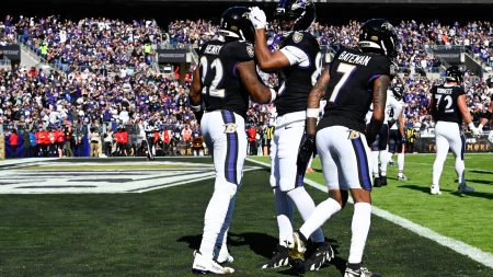 Oct 26, 2025; Baltimore, Maryland, USA; Baltimore Ravens running back Derrick Henry (22) celebrates with Baltimore Ravens tight end Isaiah Likely (80) and Baltimore Ravens wide receiver Rashod Bateman (7) after scoring a touchdown during the second quarter against the Chicago Bears at M&T Bank Stadium.