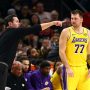 Oct 14, 2025; Phoenix, Arizona, USA; Los Angeles Lakers guard Luka Doncic (77) with head coach JJ Redick against the Phoenix Suns during an NBA preseason game at Mortgage Matchup Center.