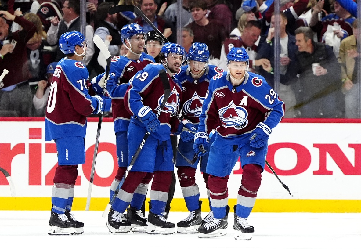 May 1, 2025; Denver, Colorado, USA; Colorado Avalanche center Nathan MacKinnon (29) celebrates his go ahead goal with defenseman Samuel Girard (49), left wing Artturi Lehkonen (62),center Martin Necas (88) and defenseman Sam Malinski (70) in the third period against the Dallas Stars against the Dallas Stars in game six of the first round of the 2025 Stanley Cup Playoffs at Ball Arena.