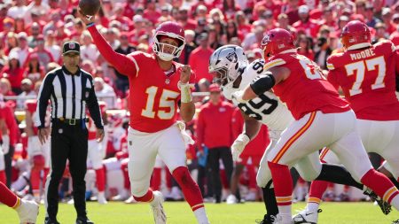 Oct 19, 2025; Kansas City, Missouri, USA; Kansas City Chiefs quarterback Patrick Mahomes (15) passes the ball against the Las Vegas Raiders during the second quarter of the game at GEHA Field at Arrowhead Stadium.