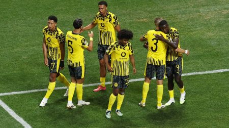 Borussia Dortmund forward Serhou Guirassy (9) celebrates scoring their second goal with teammates during a round of 16 match of the 2025 FIFA Club World Cup at Mercedes-Benz Stadium.