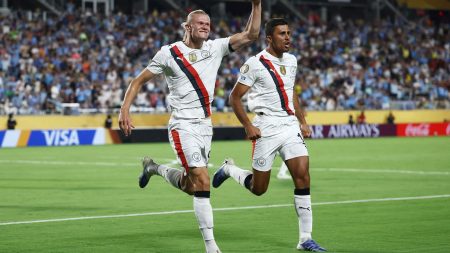 Manchester City forward Erling Haaland (9) celebrates scoring their second goal with midfielder Rodri (16) during a round of 16 match of the 2025 FIFA Club World Cup at Camping World Stadium.