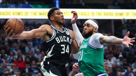 Nov 10, 2025; Dallas, Texas, USA; Milwaukee Bucks forward Giannis Antetokounmpo (34) looks to pass around Dallas Mavericks forward Daniel Gafford (21) during the first quarter at American Airlines Center.