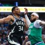 Nov 10, 2025; Dallas, Texas, USA; Milwaukee Bucks forward Giannis Antetokounmpo (34) looks to pass around Dallas Mavericks forward Daniel Gafford (21) during the first quarter at American Airlines Center.