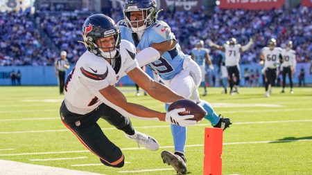 Nov 16, 2025; Nashville, Tennessee, USA; Tennessee Titans cornerback Darrell Baker Jr. (39) stops Houston Texans wide receiver Jayden Higgins (81) short of the end zone during the third quarter at Nissan Stadium.