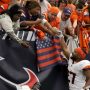 Denver Broncos running back J.K. Dobbins (27) celebrates with fans after defeating the Houston Texans at NRG Stadium.