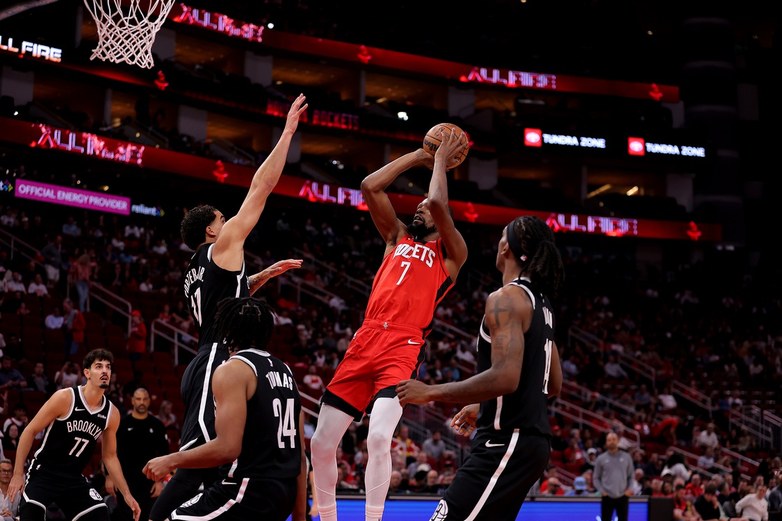 Houston, Texas, USA; Houston Rockets forward Kevin Durant (7) shoots against the Brooklyn Nets during the first quarter at Toyota Center.