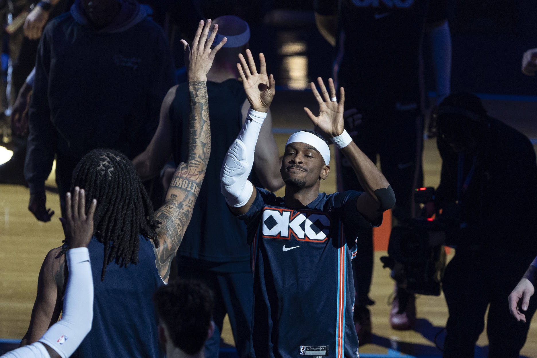 Nov 19, 2025; Oklahoma City, Oklahoma, USA; Oklahoma City Thunder guard Shai Gilgeous-Alexander (2) high fives his team during introductions before the start of a game against Sacramento Kings during the first quarter at Paycom Center.
