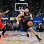 Dec 5, 2025; Detroit, Michigan, USA; Detroit Pistons guard Cade Cunningham (2) drives to the basket past Portland Trail Blazers guard Caleb Love (2) in the second quarter at Little Caesars Arena.