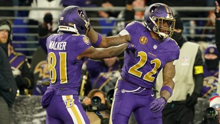 Nov 27, 2025; Baltimore, Maryland, USA; Baltimore Ravens running back Derrick Henry (22) reacts after scoring a touchdown against the Cincinnati Bengals during the first half at M&T Bank Stadium.