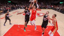 Dec 5, 2025; Atlanta, Georgia, USA; Atlanta Hawks forward Jalen Johnson (1) shoots past Denver Nuggets guard Jamal Murray (27) in the fourth quarter at State Farm Arena.