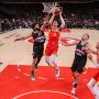Dec 5, 2025; Atlanta, Georgia, USA; Atlanta Hawks forward Jalen Johnson (1) shoots past Denver Nuggets guard Jamal Murray (27) in the fourth quarter at State Farm Arena.