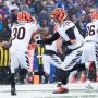 Dec 7, 2025; Orchard Park, New York, USA; Cincinnati Bengals quarterback Joe Burrow (9) hands the ball off to running back Chase Brown (30) in the first quarter against the Buffalo Bills at Highmark Stadium.