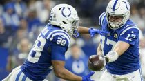 Dec 28, 2025; Indianapolis, Indiana, USA; Indianapolis Colts quarterback Philip Rivers (17) hands the ball to Indianapolis Colts running back Jonathan Taylor (28) during a game against the Jacksonville Jaguars at Lucas Oil Stadium at Lucas Oil Stadium.