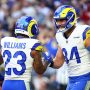 Dec 7, 2025; Glendale, Arizona, USA; Los Angeles Rams running back Kyren Williams (23) reacts with tight end Colby Parkinson (84) after scoring a touchdown during the first half at State Farm Stadium.