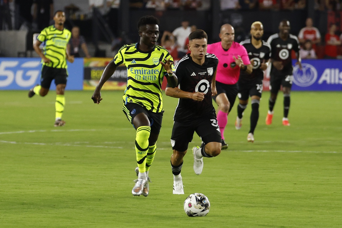 Jul 19, 2023; Washington, DC, USA; Arsenal midfielder Bukayo Saka (7) and MLS defender Alvaro Barreal (31) of FC Cincinnati race for the ball during the first half of the 2023 MLS All Star Game at Audi Field.