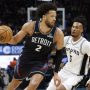 Feb 23, 2026; Detroit, Michigan, USA; Detroit Pistons guard Cade Cunningham (2) dribbles on San Antonio Spurs guard Stephon Castle (5) in the second half at Little Caesars Arena.